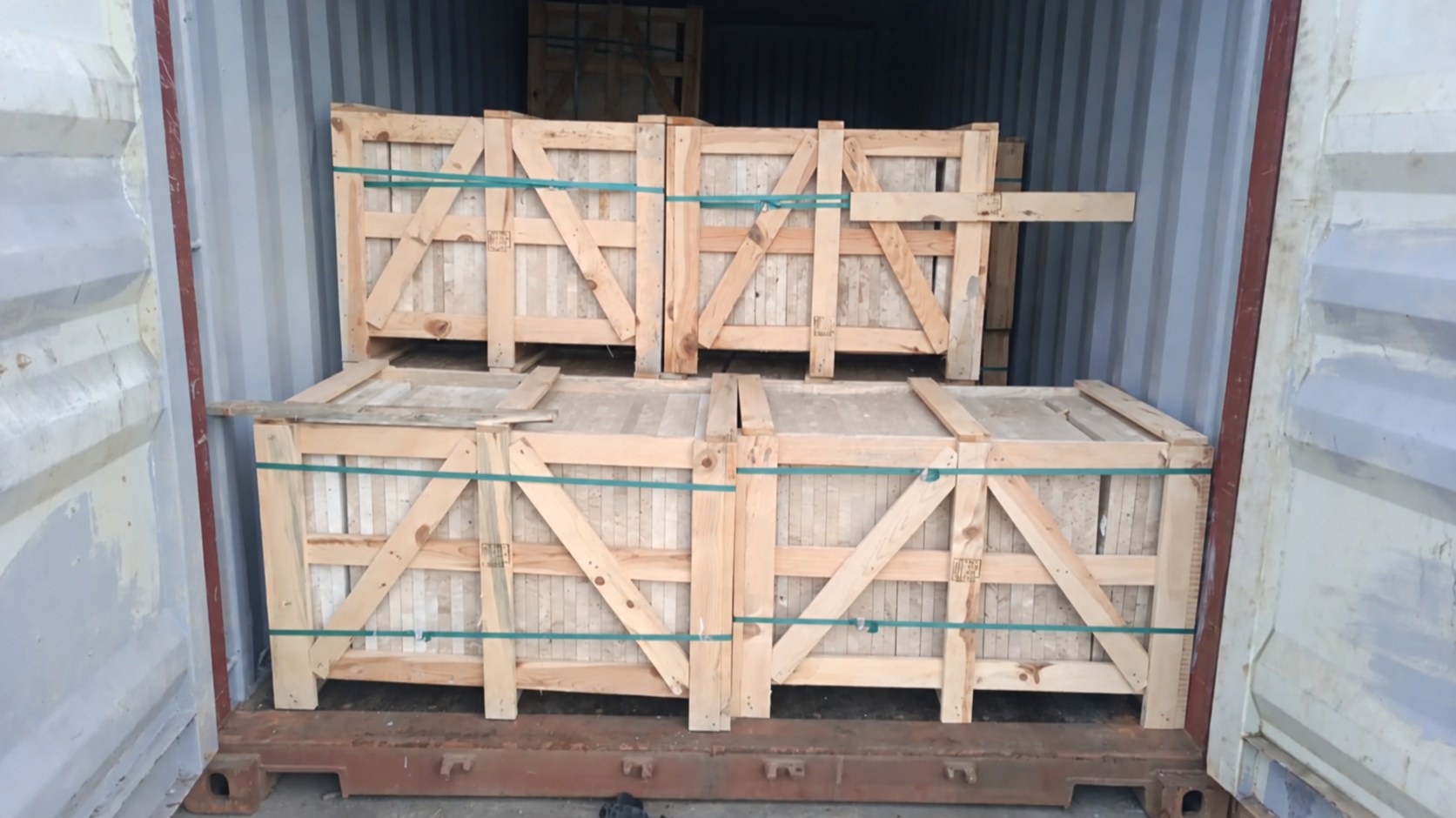 America shipment 1 — packed natural stone crates, container identification concealed