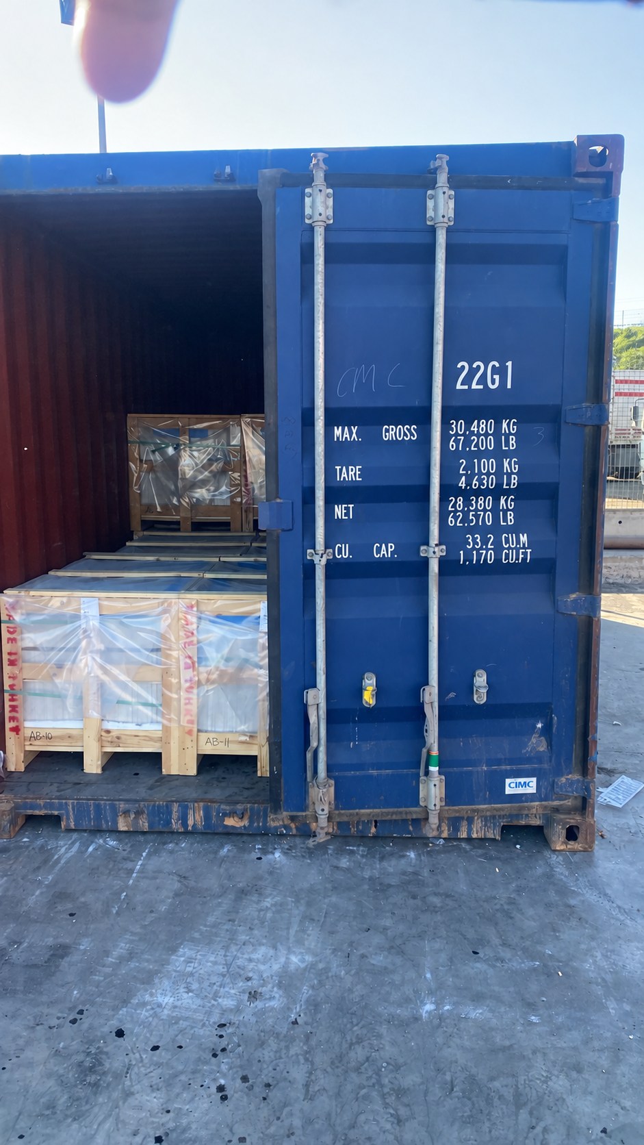 America shipment 5 — packed natural stone crates, container identification concealed