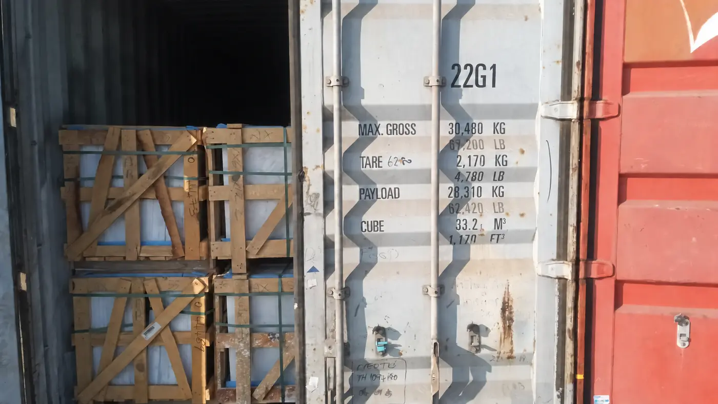 Packed natural stone crates inside a shipment container